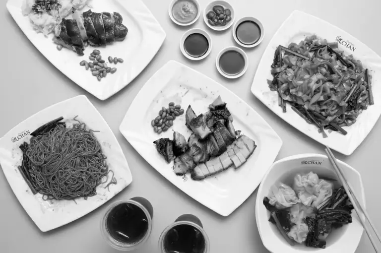 Assorted Michelin hawker dishes including chicken rice, char siu, noodles, and soups overhead view