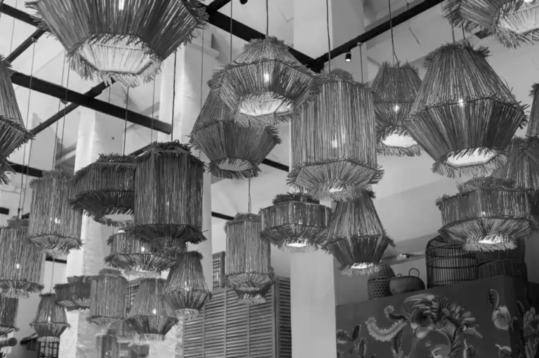 Woven rattan pendant lights hanging from ceiling at Candlenut restaurant