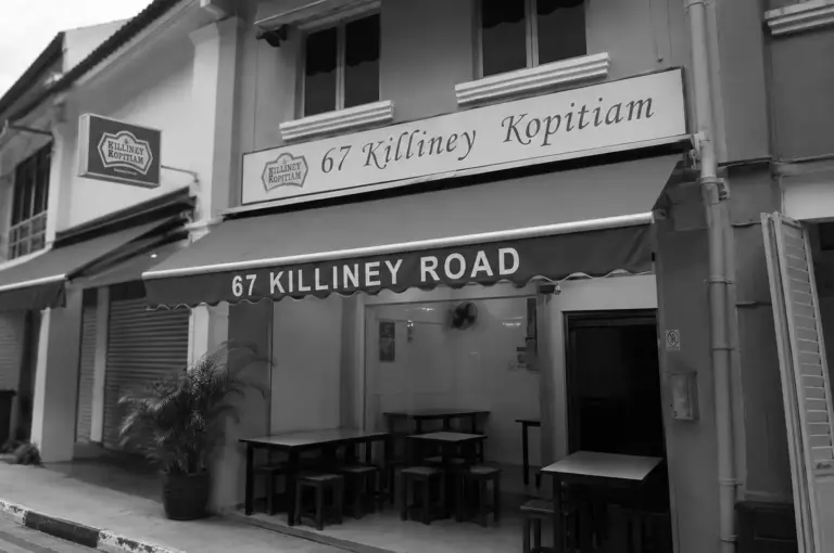 Facade of 67 Killiney Kopitiam on Killiney Road showing outdoor seating and traditional signage