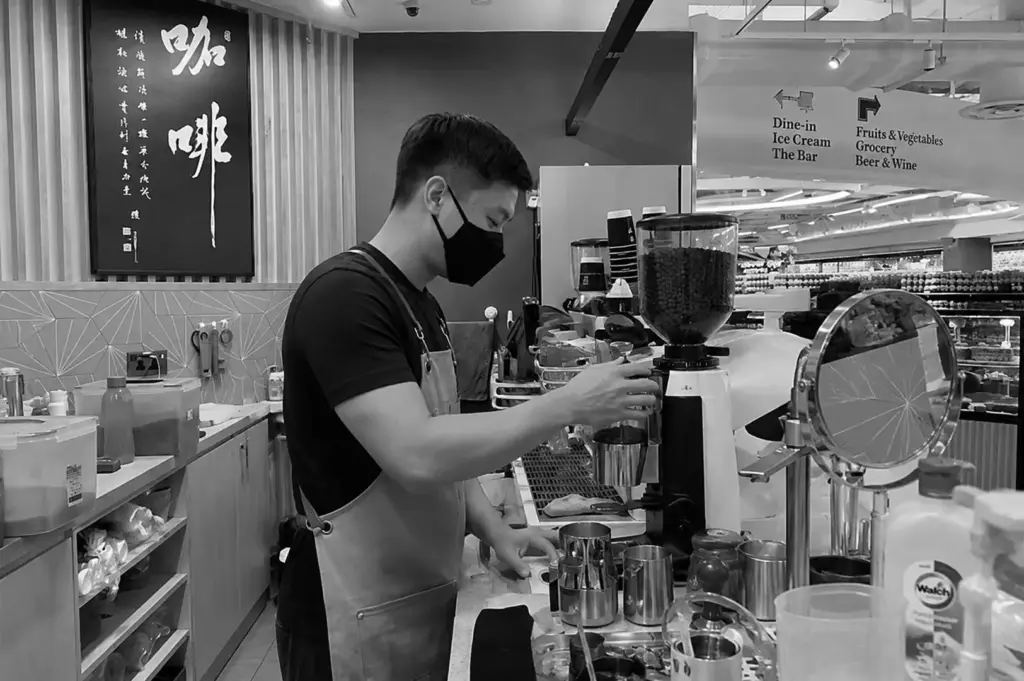 Barista preparing specialty coffee in a Singapore café