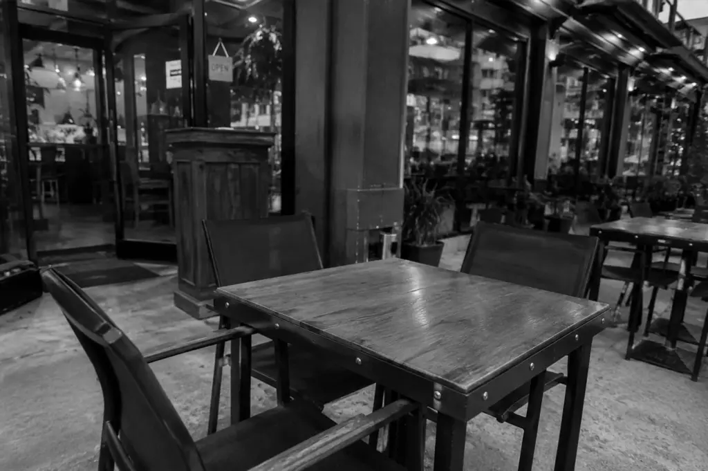 Empty outdoor restaurant table waiting for walk-in diners during evening service.