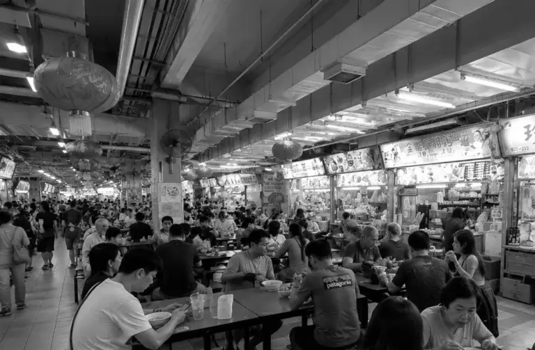 Busy Chinatown Complex Food Centre filled with diners and food stalls.