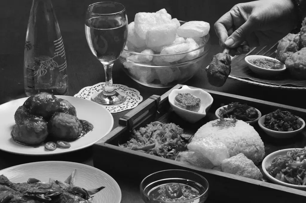 A selection of plated dishes arranged across a restaurant table, showcasing a curated multi-course meal.