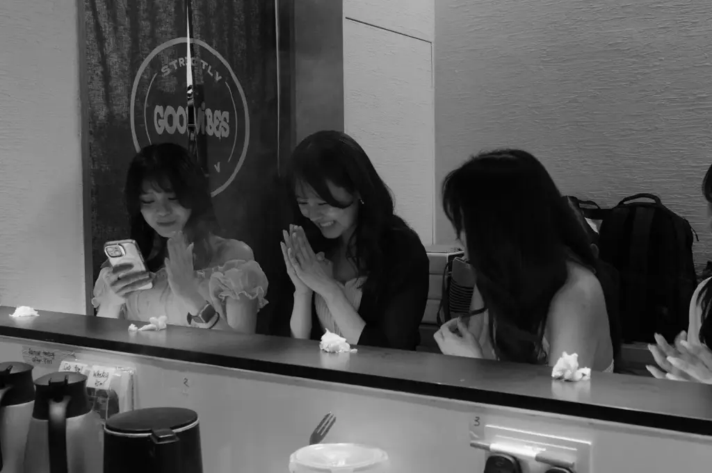 Diners enjoying sushi together at the standing sushi counter